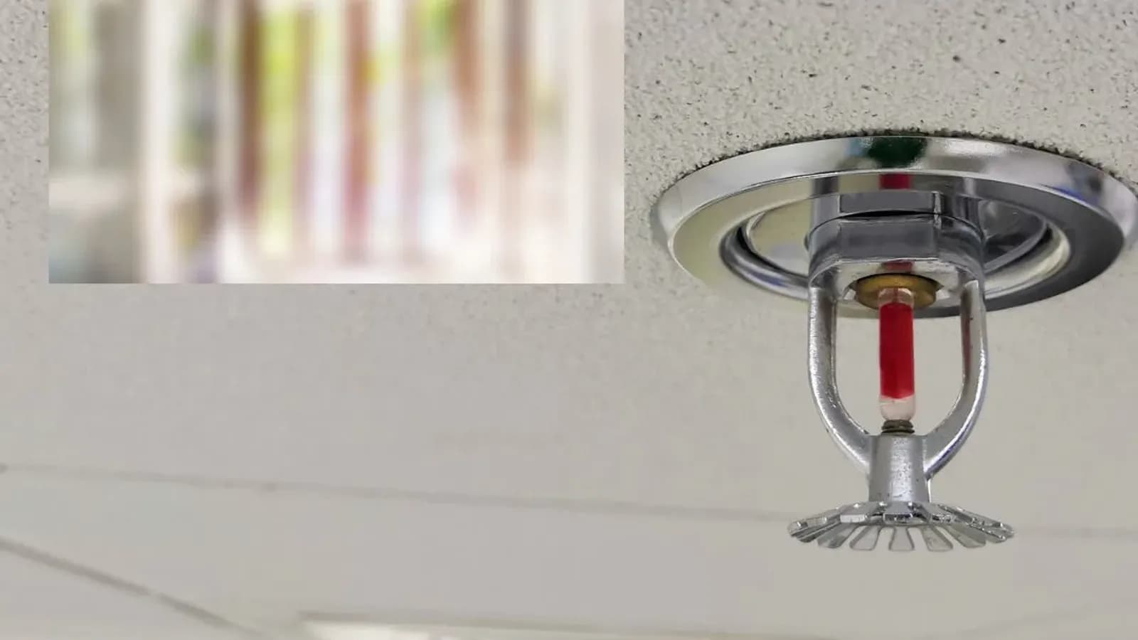 Smoke or carbon monoxide detector on ceiling